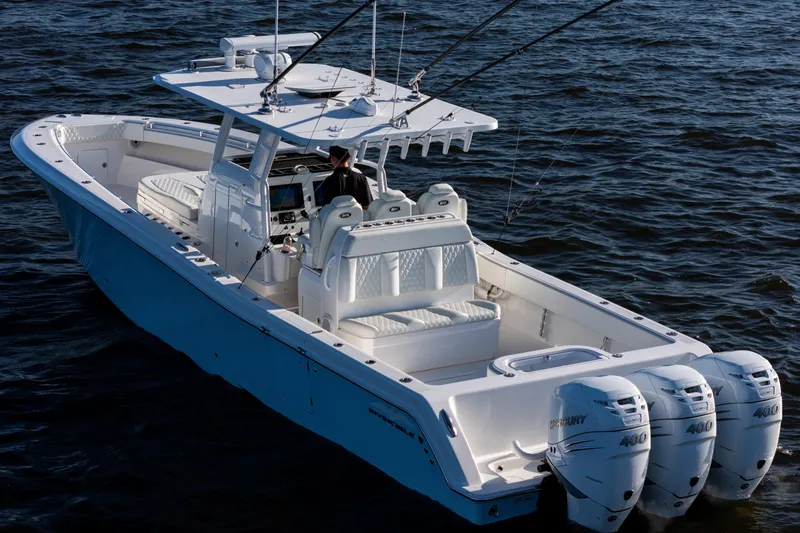 Slide: The Image of 2022 Invincible 39 Open Fisherman boat with triple Mercury engines on the water. - 4