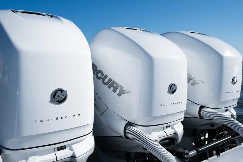 Slide: The Image of Triple Mercury FourStroke engines on a 2022 Invincible 39 Open Fisherman boat. - 31
