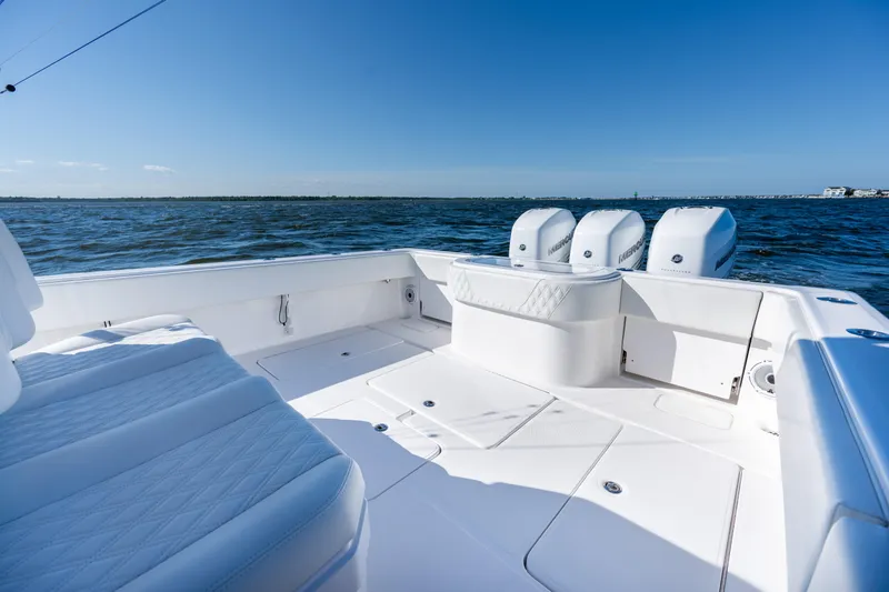 Slide: The Image of 2022 Invincible 39 Open Fisherman boat with triple engines on open water. - 23