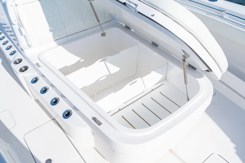Slide: The Image of Open storage compartment on 2022 Invincible 39 Open Fisherman boat, showcasing sleek design. - 12