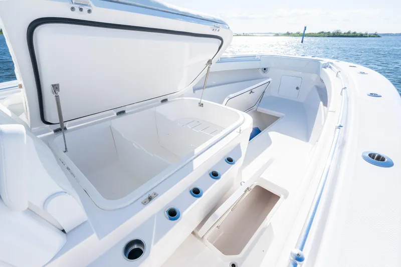Slide: The Image of 2022 Invincible 39 Open Fisherman boat with open storage compartments on deck. - 10