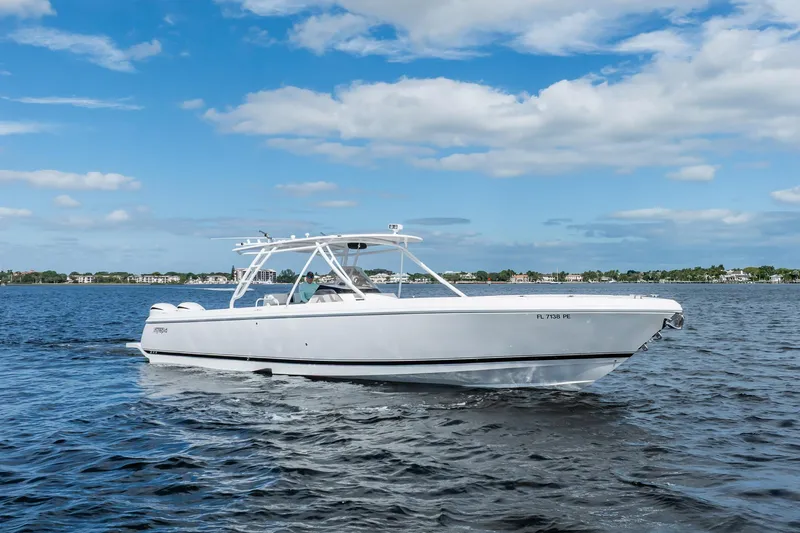 The Image of 2011 Intrepid 400 Center Console boat cruising on a sunny day. - 1