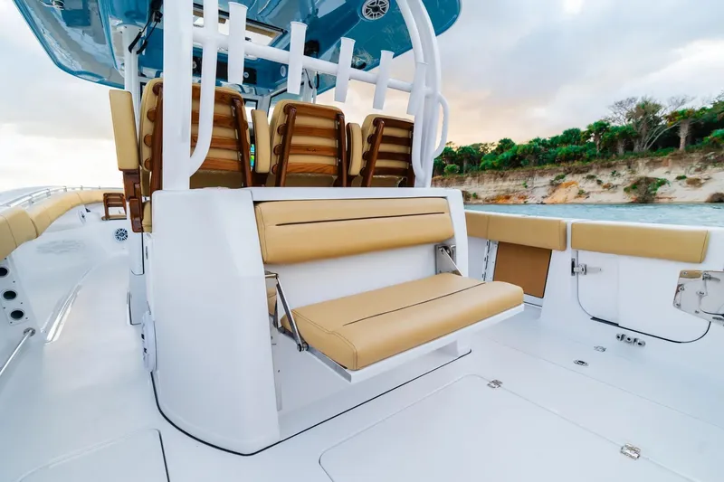 Slide: The Image of 2026 Sportsman Open 352 Center Console boat with tan seating and sleek design. - 26