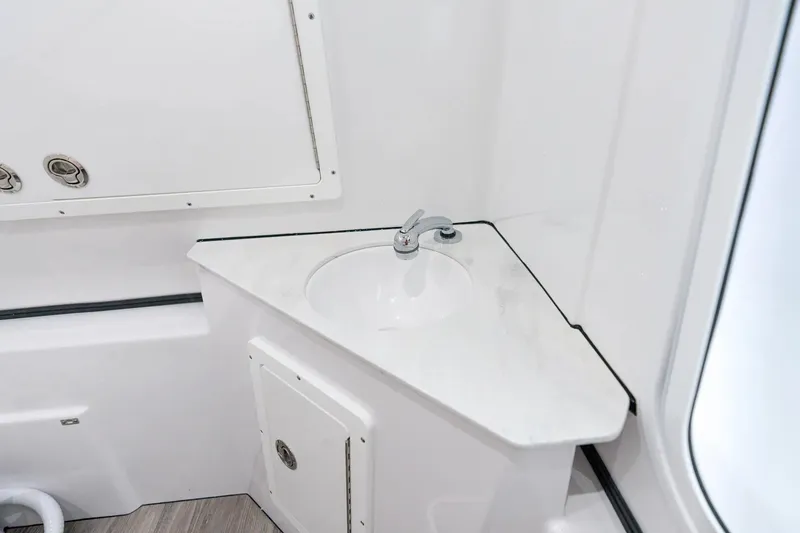 Slide: The Image of 2026 Sportsman Open 352 Center Console interior sink with modern design and fixtures. - 22