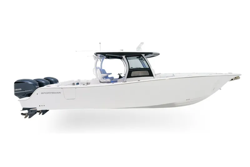 Slide: The Image of 2027 Sportsman Open 352 Center Console boat with triple Yamaha engines, sleek white design. - 0