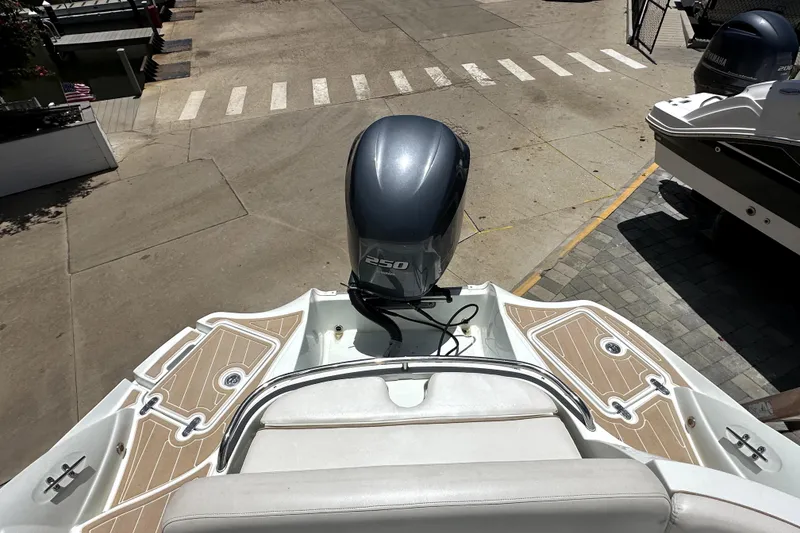Slide: The Image of 2014 SouthWind 2400 SD boat with Yamaha 250 engine, docked on a sunny day. - 8