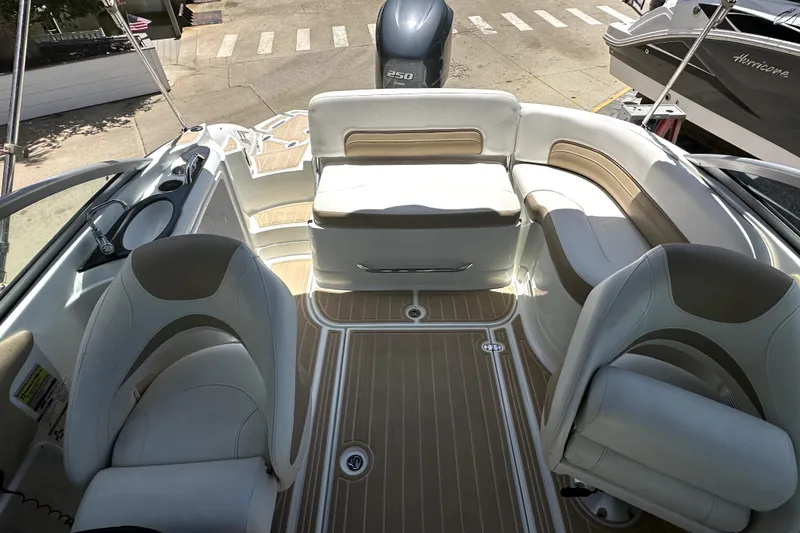 Slide: The Image of 2014 SouthWind 2400 SD boat interior with seating and deck view. - 7