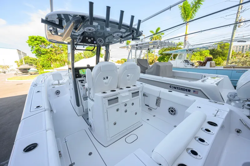 Slide: The Image of 2027 Sportsman Open 262 Center Console boat interior with seating and fishing rod holders. - 35