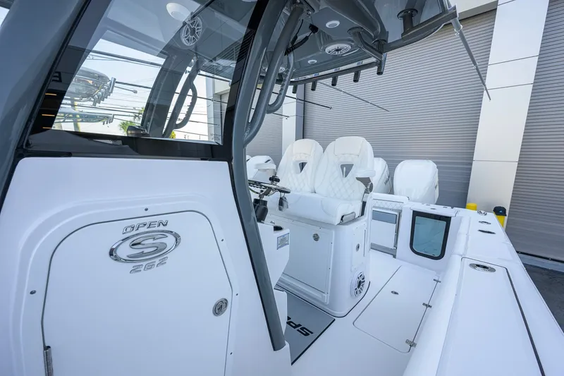 Slide: The Image of 2027 Sportsman Open 262 Center Console boat interior with white seating and modern design. - 9
