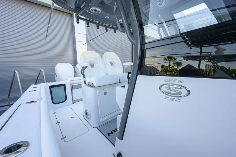 Slide: The Image of 2027 Sportsman Open 262 Center Console boat with sleek white seating and modern design. - 21