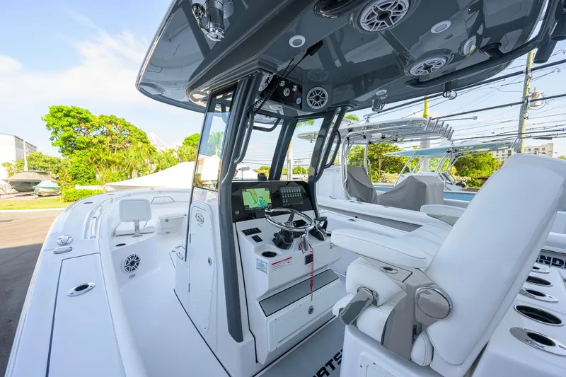 Slide: The Image of 2027 Sportsman Open 262 Center Console boat interior with modern helm and seating. - 5