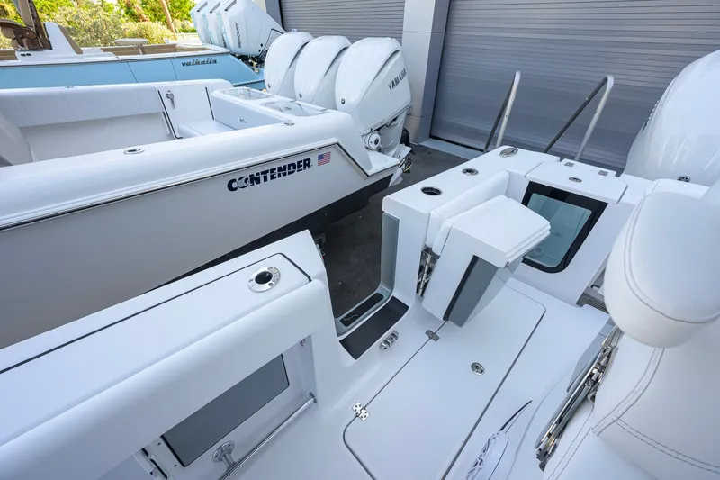 Slide: The Image of 2027 Sportsman Open 262 Center Console boat with Yamaha engines and Contender branding. - 37