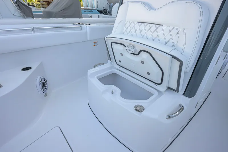 Slide: The Image of 2027 Sportsman Open 262 Center Console boat interior with open storage compartment. - 18