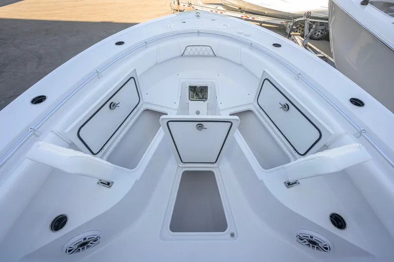 Slide: The Image of 2027 Sportsman Open 262 Center Console boat interior with open storage compartments. - 13