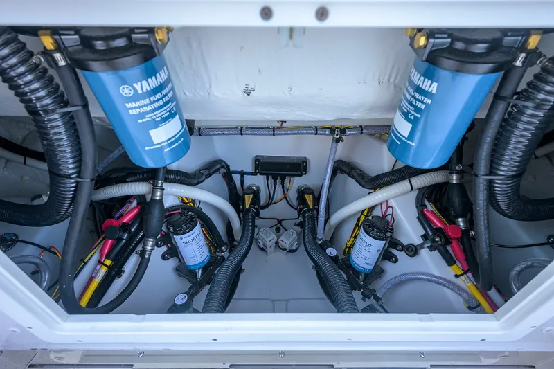 Slide: The Image of 2027 Sportsman Open 262 Center Console engine compartment with Yamaha marine fuel filters. - 44