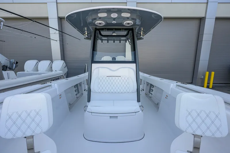 Slide: The Image of 2027 Sportsman Open 262 Center Console boat with sleek white seating and modern design. - 16