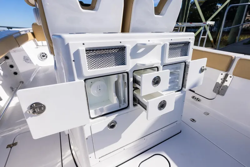 Slide: The Image of Manufacturer Provided Image: 2025 Sportsman Open 262 Center Console boat with open storage compartments. - 8