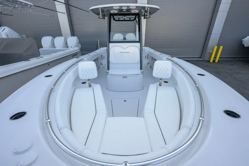 Slide: The Image of 2027 Sportsman Open 262 Center Console boat with sleek white seating and modern design. - 15