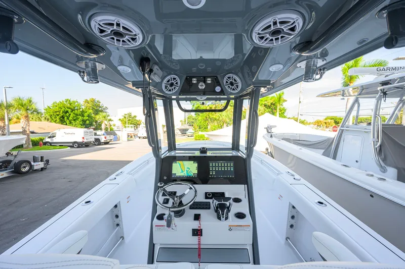 Slide: The Image of 2027 Sportsman Open 262 Center Console boat interior with advanced navigation system and sleek design. - 6