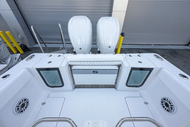 Slide: The Image of 2027 Sportsman Open 262 Center Console boat with dual engines and spacious deck layout. - 27