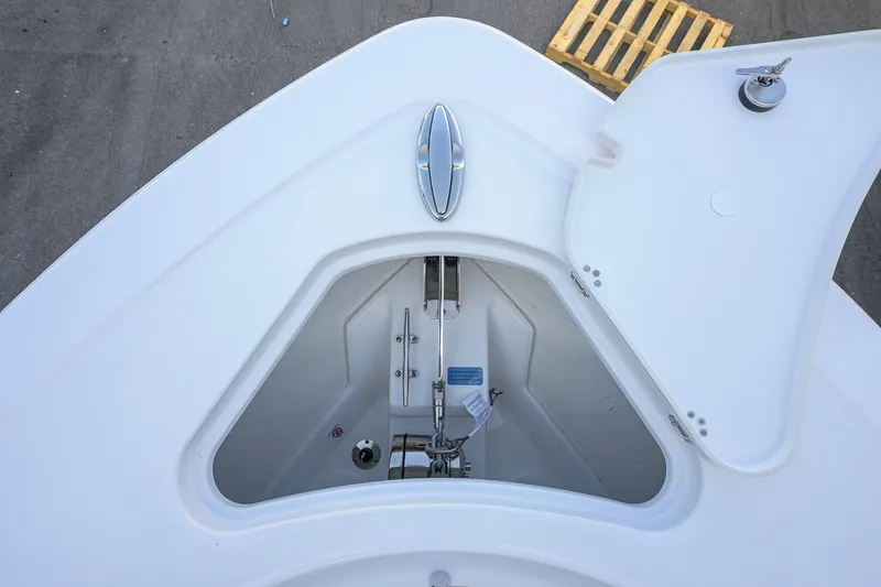 Slide: The Image of Bow storage compartment of 2027 Sportsman Open 262 Center Console boat. - 14