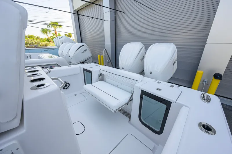 Slide: The Image of 2027 Sportsman Open 262 Center Console boat with dual Yamaha engines and sleek interior design. - 31
