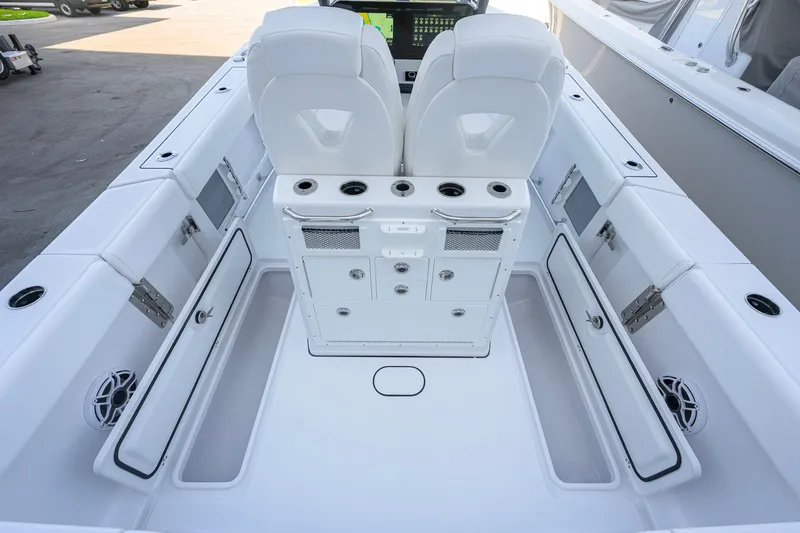 Slide: The Image of 2027 Sportsman Open 262 Center Console boat interior with seating and storage compartments. - 39