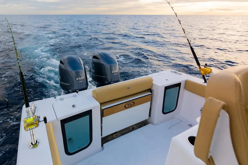 Slide: The Image of Manufacturer Provided Image: 2025 Sportsman Open 262 Center Console boat on open water, featuring dual engines. - 9
