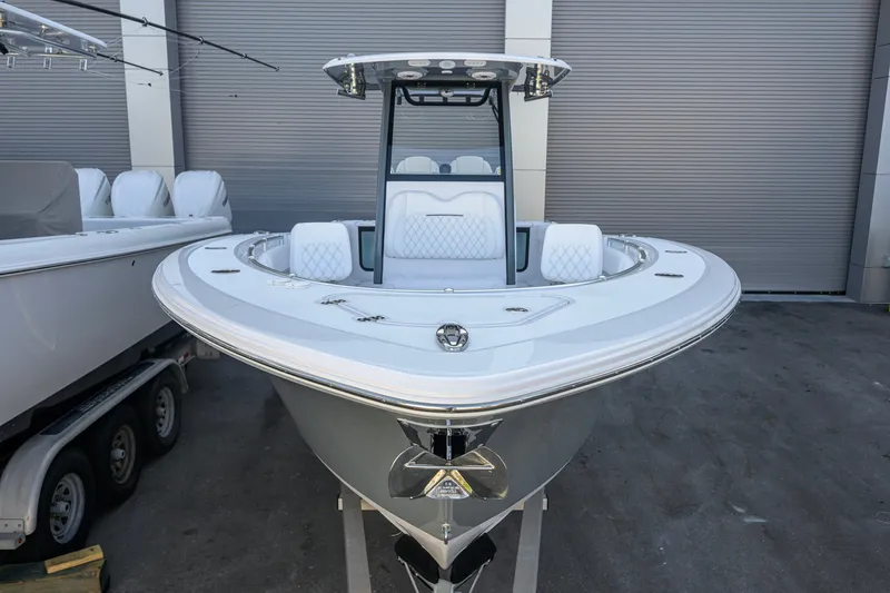 Slide: The Image of 2027 Sportsman Open 262 Center Console boat in showroom, front view. - 1