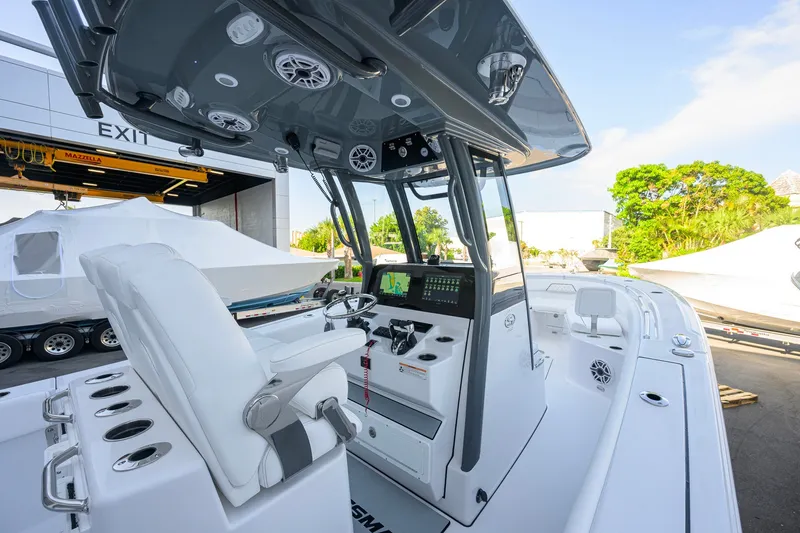 Slide: The Image of 2027 Sportsman Open 262 Center Console boat interior with modern controls and seating. - 22