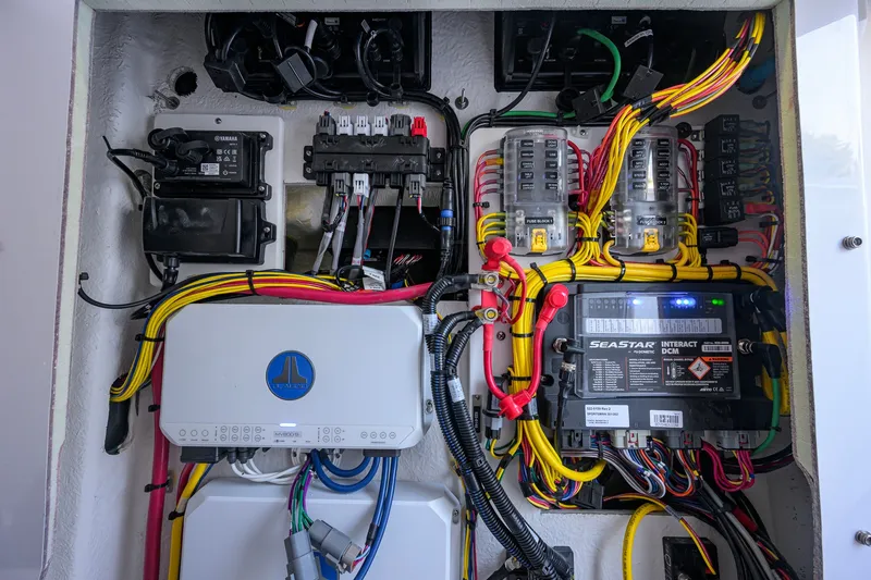 Slide: The Image of Electrical system of a 2027 Sportsman Open 262 Center Console boat, showcasing wiring and components. - 51