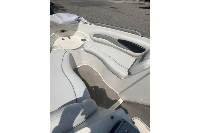Slide: The Image of 2008 Stingray 195 LX boat interior with white seating and cup holders. - 13