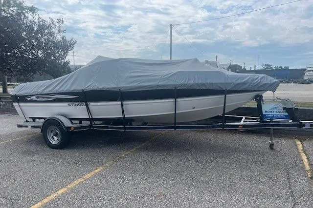 Slide: The Image of Covered 2008 Stingray 195 LX boat on trailer in parking lot. - 3