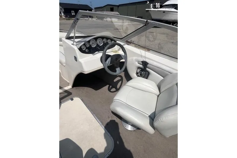 Slide: The Image of 2008 Stingray 195 LX boat interior with steering wheel and dashboard controls. - 11