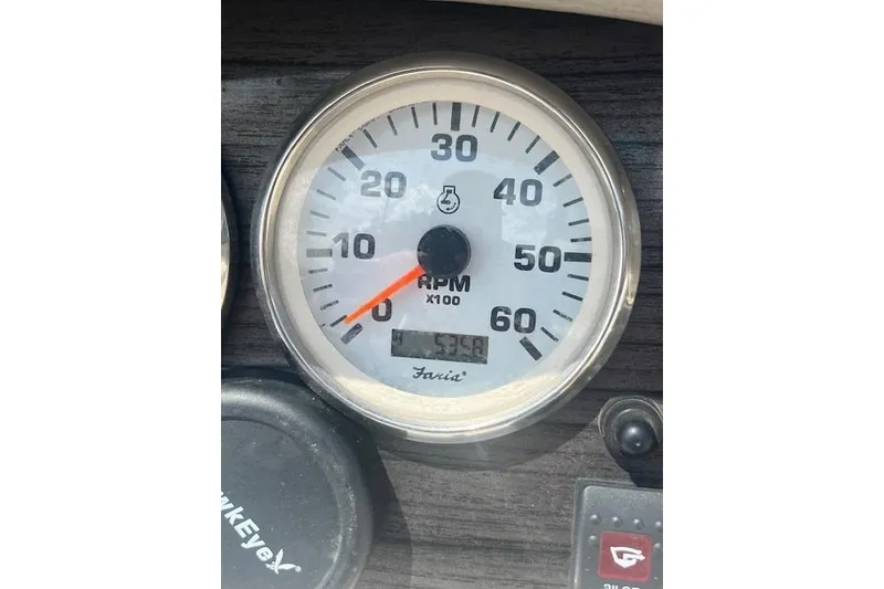 Slide: The Image of Tachometer displaying RPM in a 2008 Stingray 195 LX boat dashboard. - 17