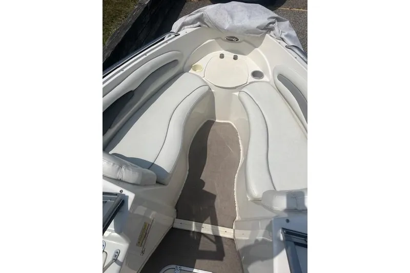 Slide: The Image of 2008 Stingray 195 LX boat interior with white seating and carpeted floor. - 20