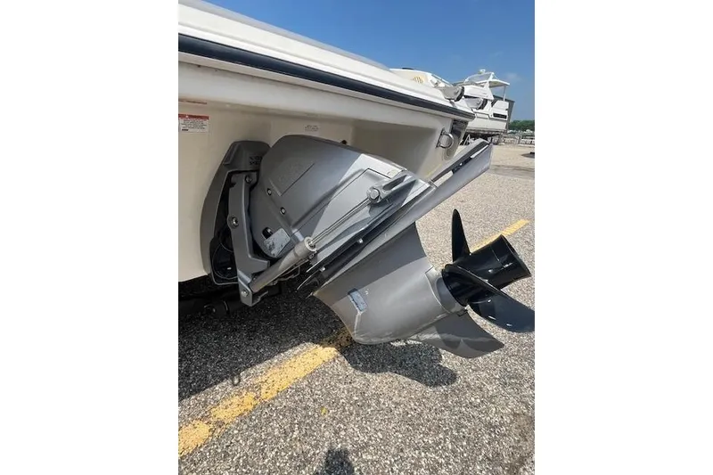 Slide: The Image of 2008 Stingray 195 LX boat propeller and stern drive on a sunny day. - 15
