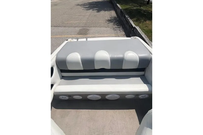 Slide: The Image of 2008 Stingray 195 LX boat interior with gray and white seating. - 7