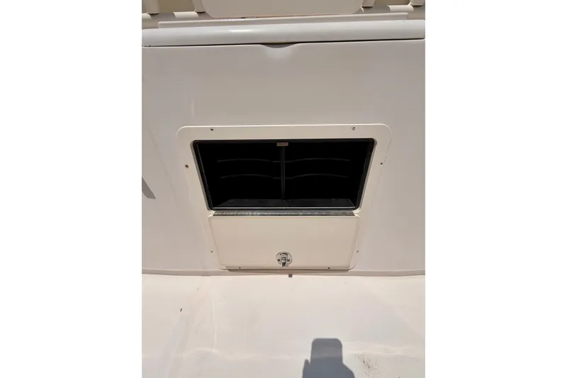 Slide: The Image of 2011 Grady-White Canyon 366 boat compartment with a closed hatch and vent. - 24