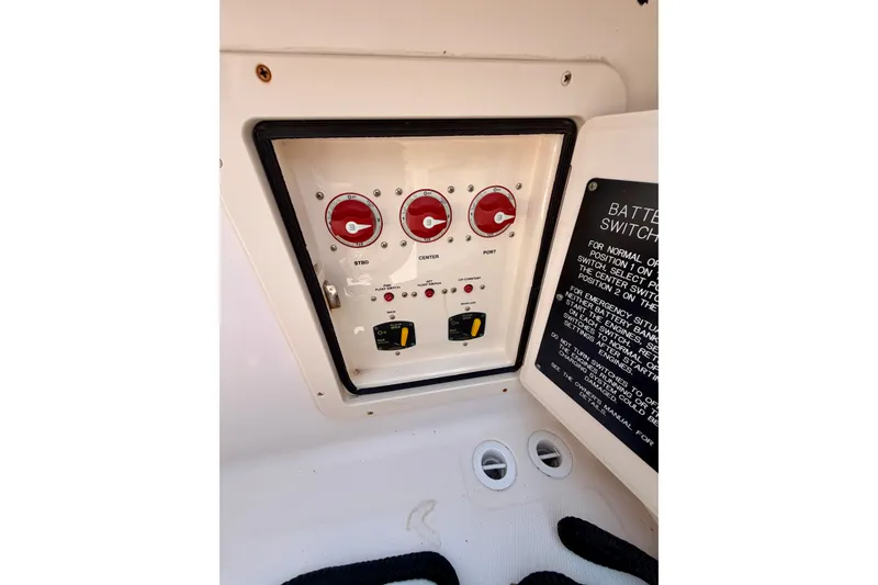 Slide: The Image of Control panel of a 2011 Grady-White Canyon 366 boat with battery switches. - 41