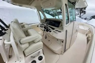 Slide: The Image of 2011 Grady-White Canyon 366 boat interior with helm station and seating. - 10