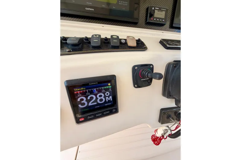 Slide: The Image of Control panel of a 2011 Grady-White Canyon 366 boat with Garmin display. - 38