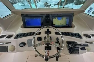 Slide: The Image of 2011 Grady-White Canyon 366 helm with dual navigation screens and steering wheel. - 9