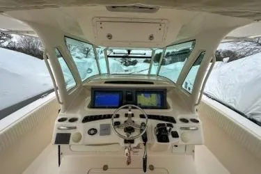 Slide: The Image of 2011 Grady-White Canyon 366 helm with dual navigation screens and steering wheel. - 8