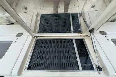 Slide: The Image of 2011 Grady-White Canyon 366 boat deck with storage compartments and grill. - 11