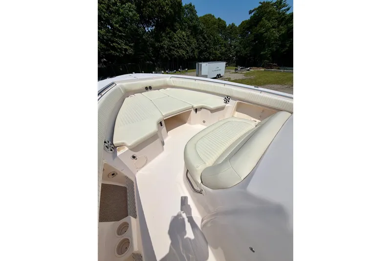 Slide: The Image of 2011 Grady-White Canyon 366 boat interior with cushioned seating and spacious deck. - 28