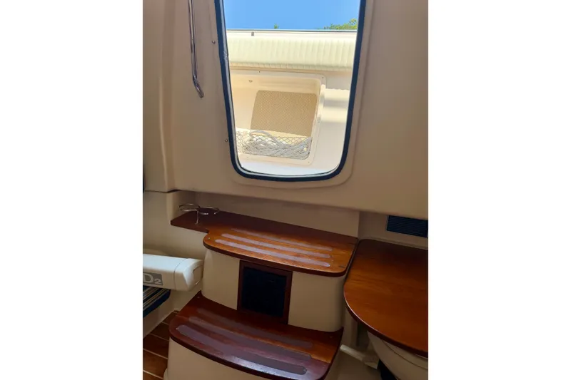 Slide: The Image of Interior view of 2011 Grady-White Canyon 366 boat with wooden steps and window. - 32