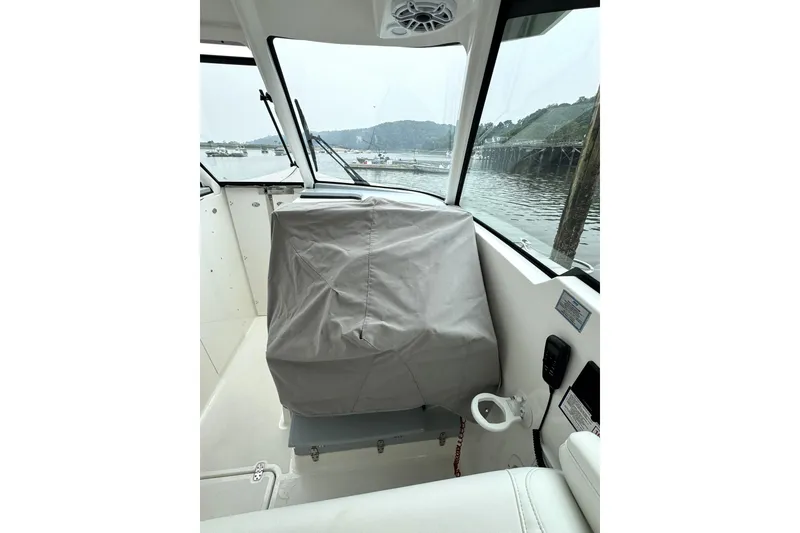 Slide: The Image of Interior view of 2024 Pursuit DC 326 Dual Console boat with covered helm station. - 36