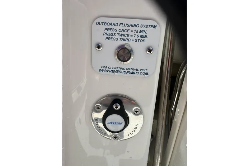 Slide: The Image of 2024 Pursuit DC 326 Dual Console outboard flushing system with Reverso engine flush controls. - 22