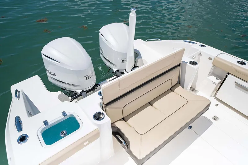 Slide: The Image of Manufacturer Provided Image: 2024 Pursuit DC 326 Dual Console boat with twin Yamaha engines and beige seating. - 10